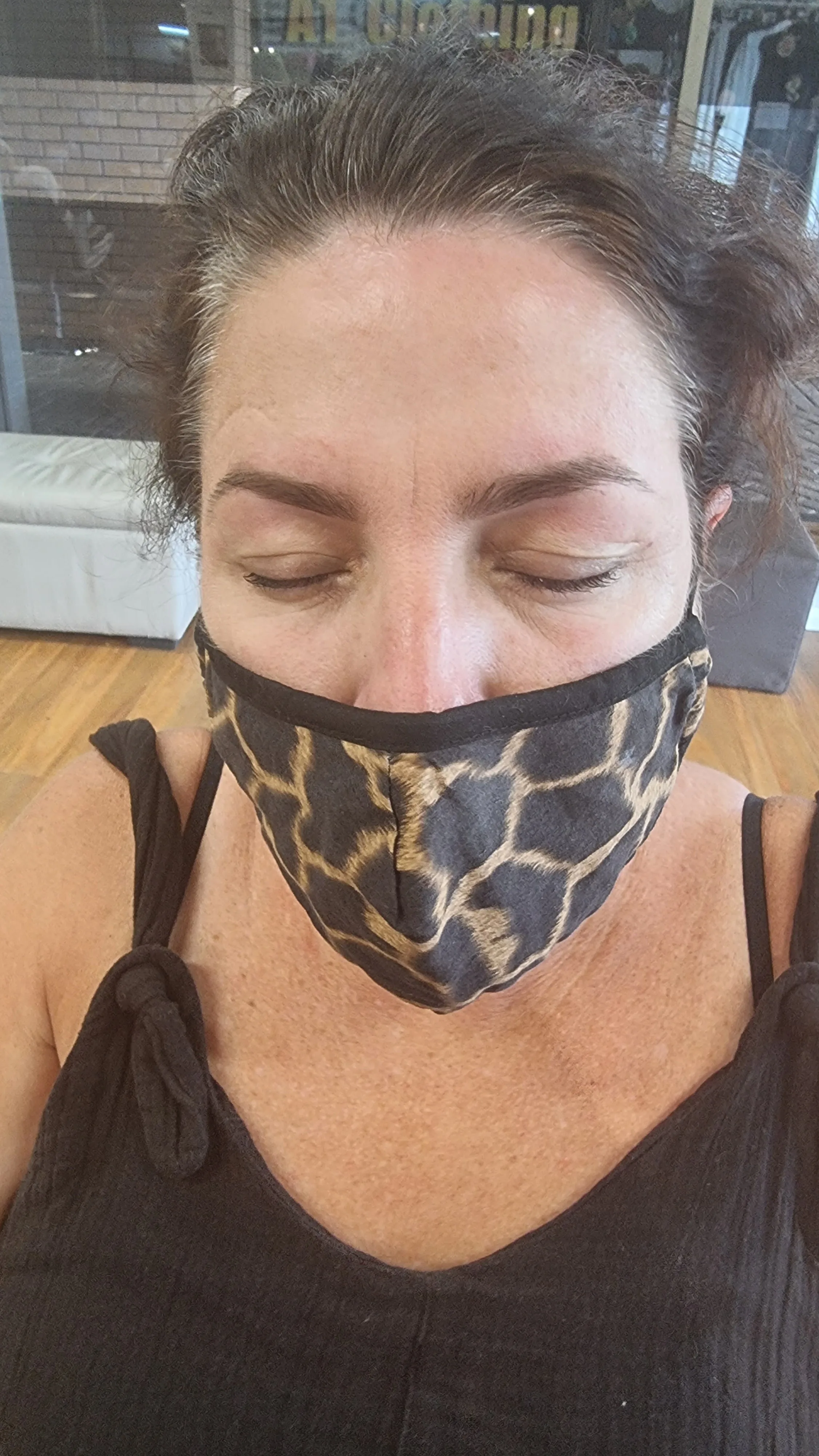 Newly threaded brows, client at the shopfront window