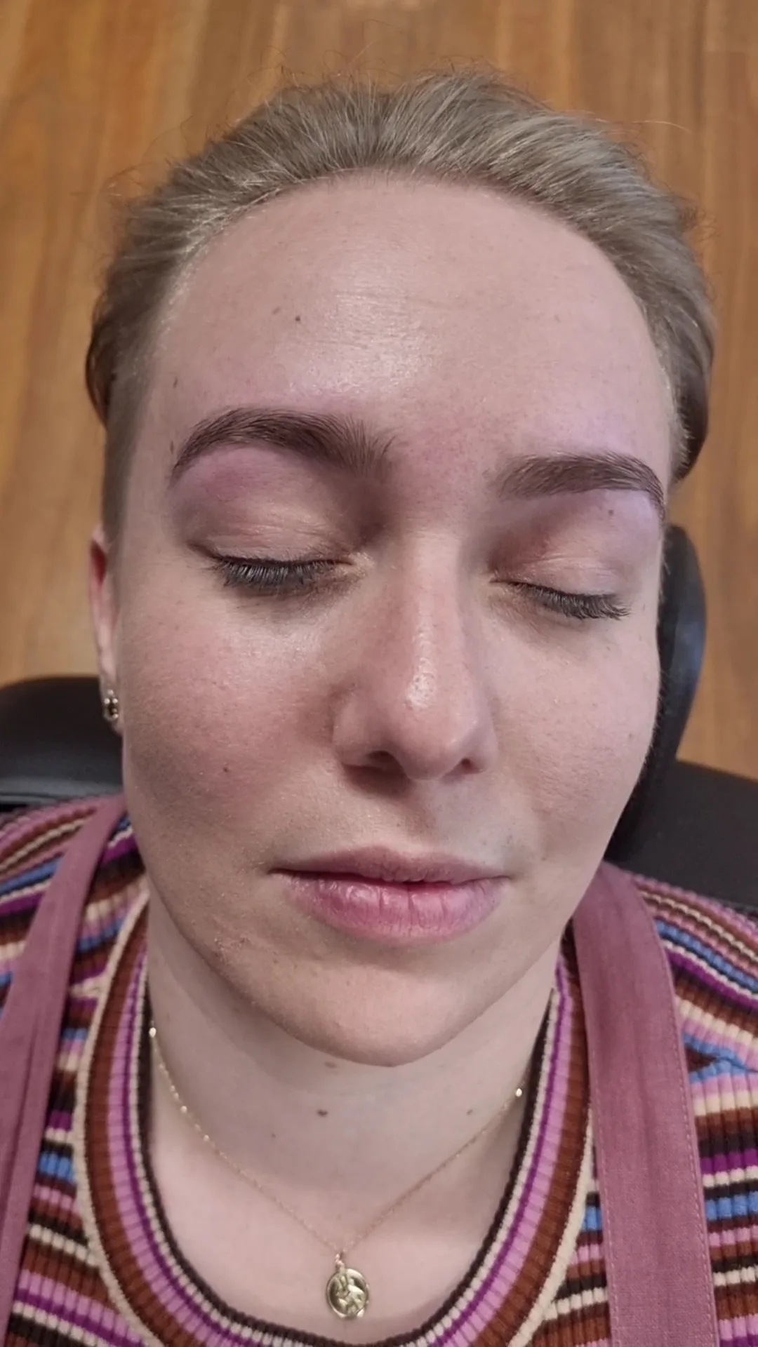 Close-up of a clean, precisely threaded brow shape